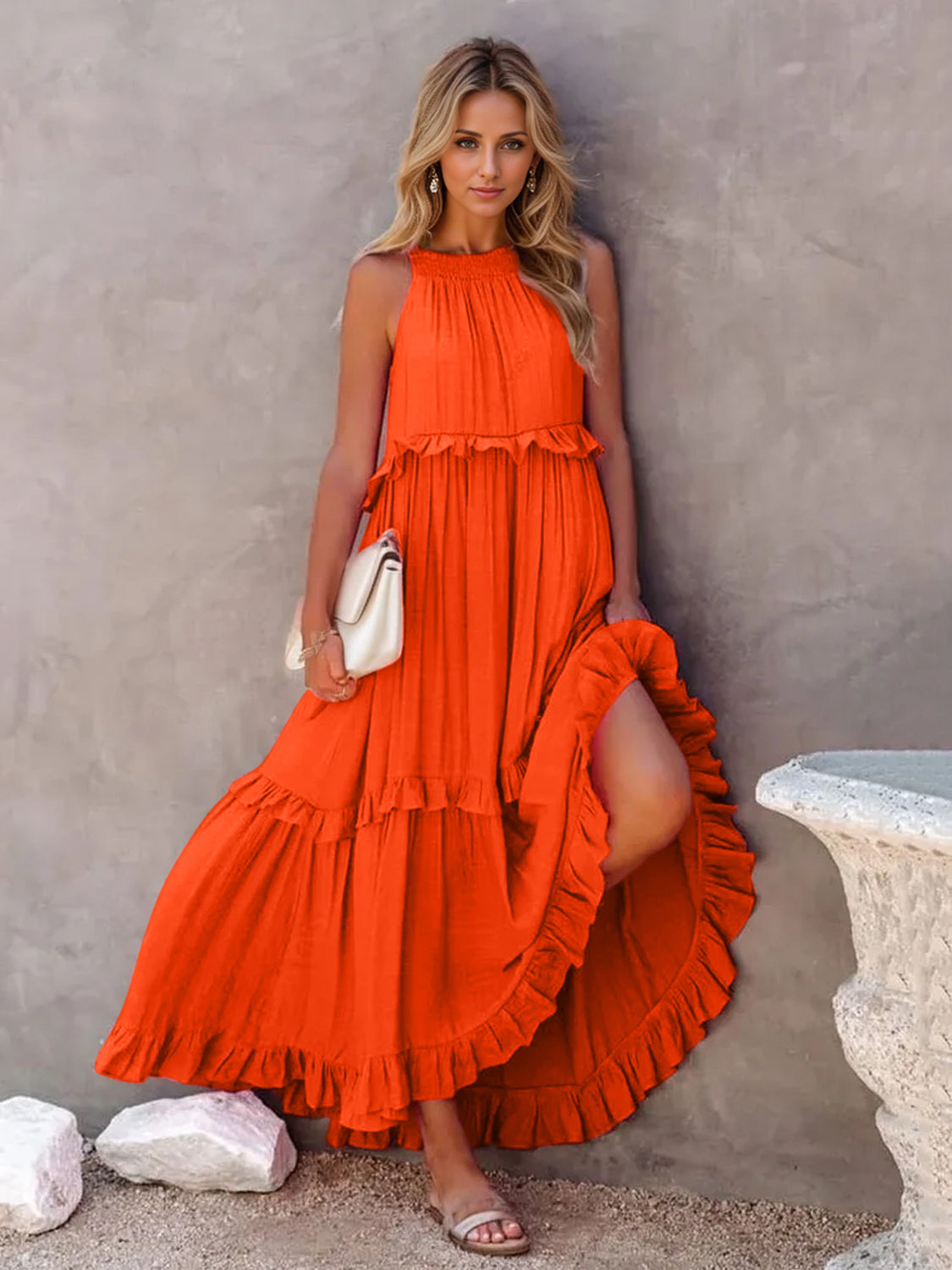 Ruffled sleeveless tiered maxi dress in vibrant orange with pockets.