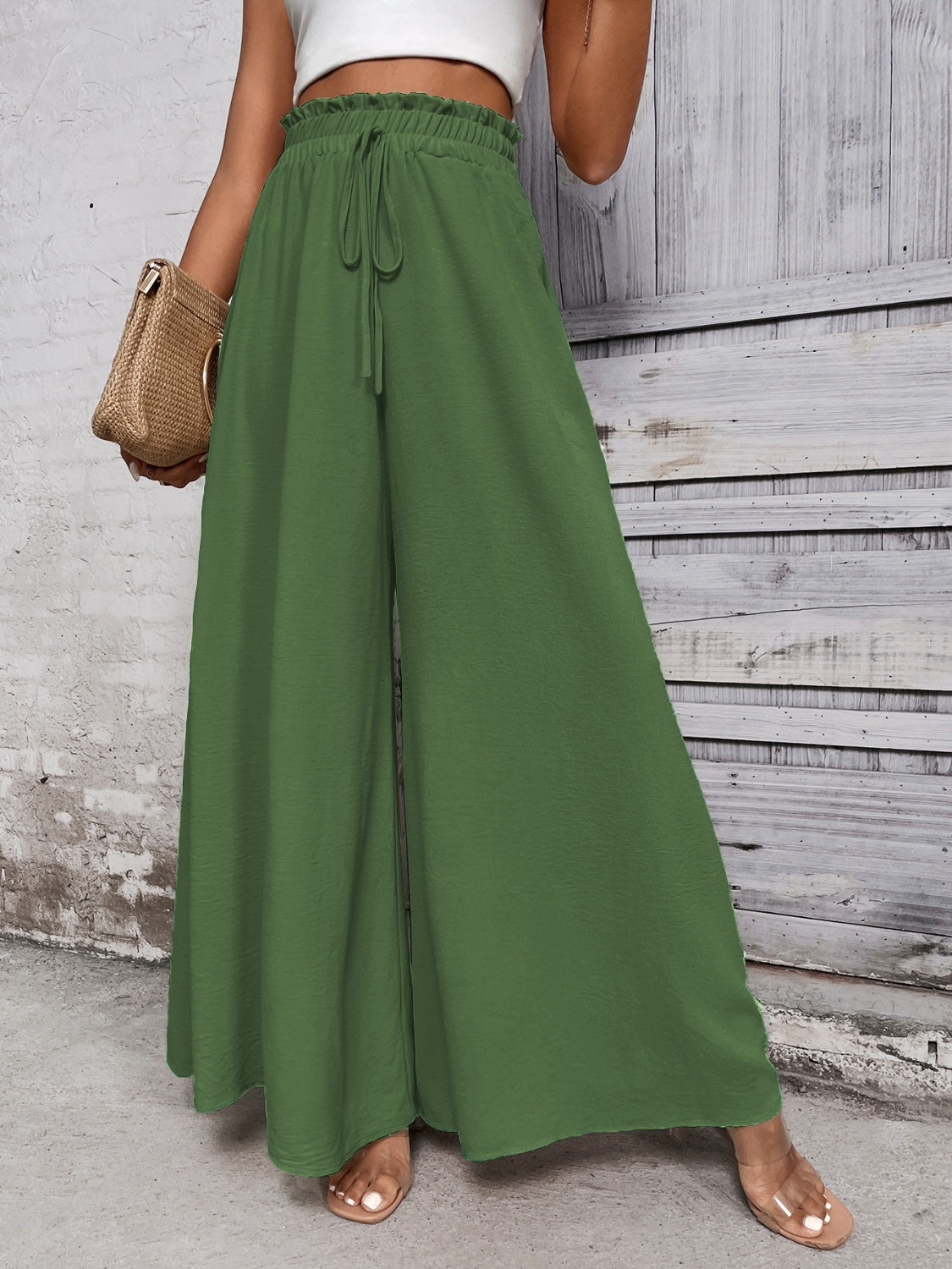 Boho high waist wide leg pants in green, tied at the waist, made of 100% cotton.