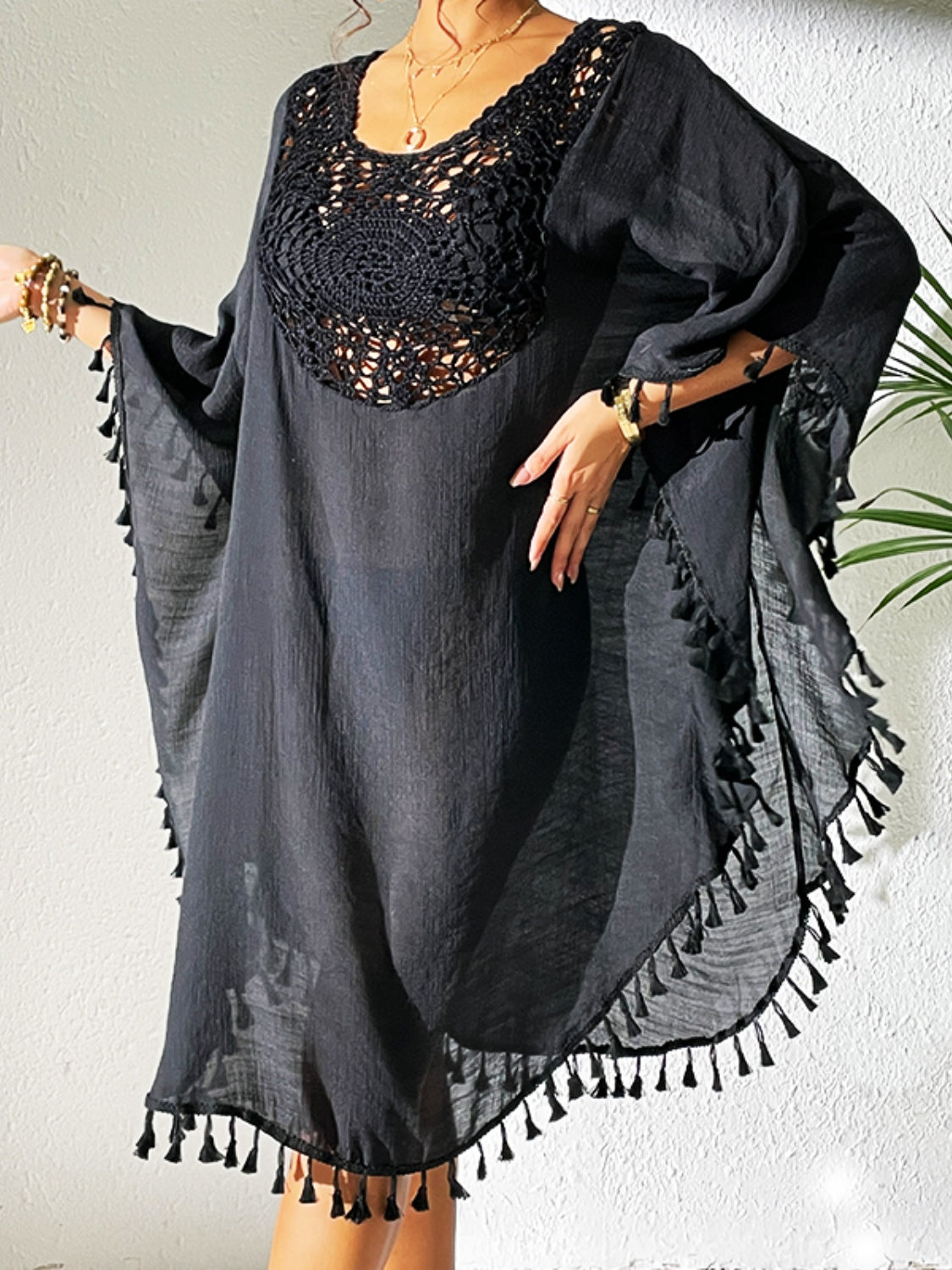 Tassel cutout scoop neck cover-up dress in semi-sheer black with crochet detail.