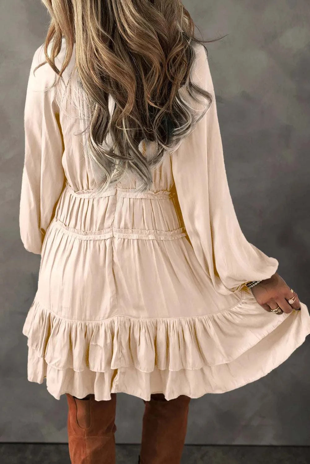 Frill ruffled V-neck long sleeve mini dress in cream.