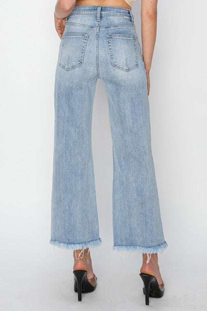 High rise crop wide fray hem jeans with a relaxed fit and stylish frayed edges.