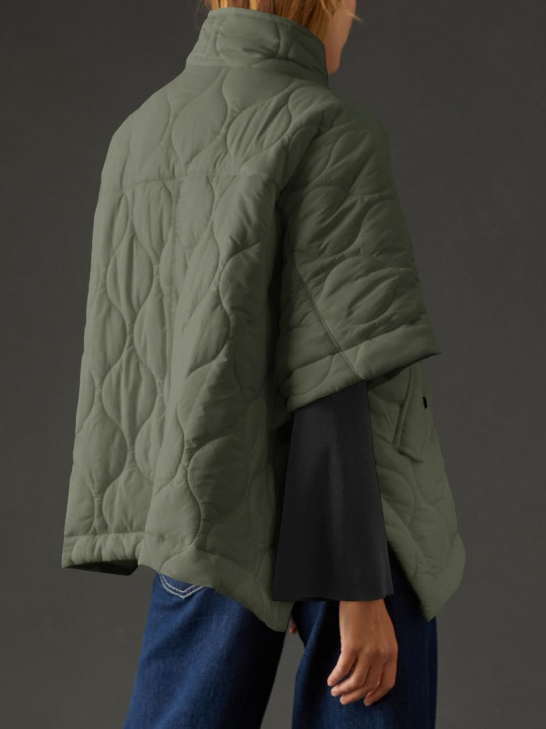 Textured half zip pullover poncho in olive green with a quilted design, made from 100% polyester.