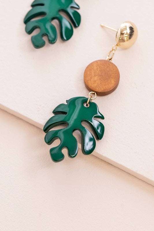 Tropical leaf dangle earrings in green acetate with brass accents.