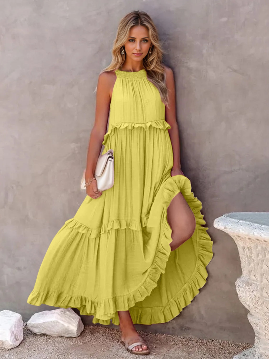 Ruffled sleeveless tiered maxi dress with pockets in yellow, featuring high-low hem and smocked detailing.