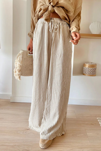 Women's pocketed striped wide leg pants, high waist, casual chic style.