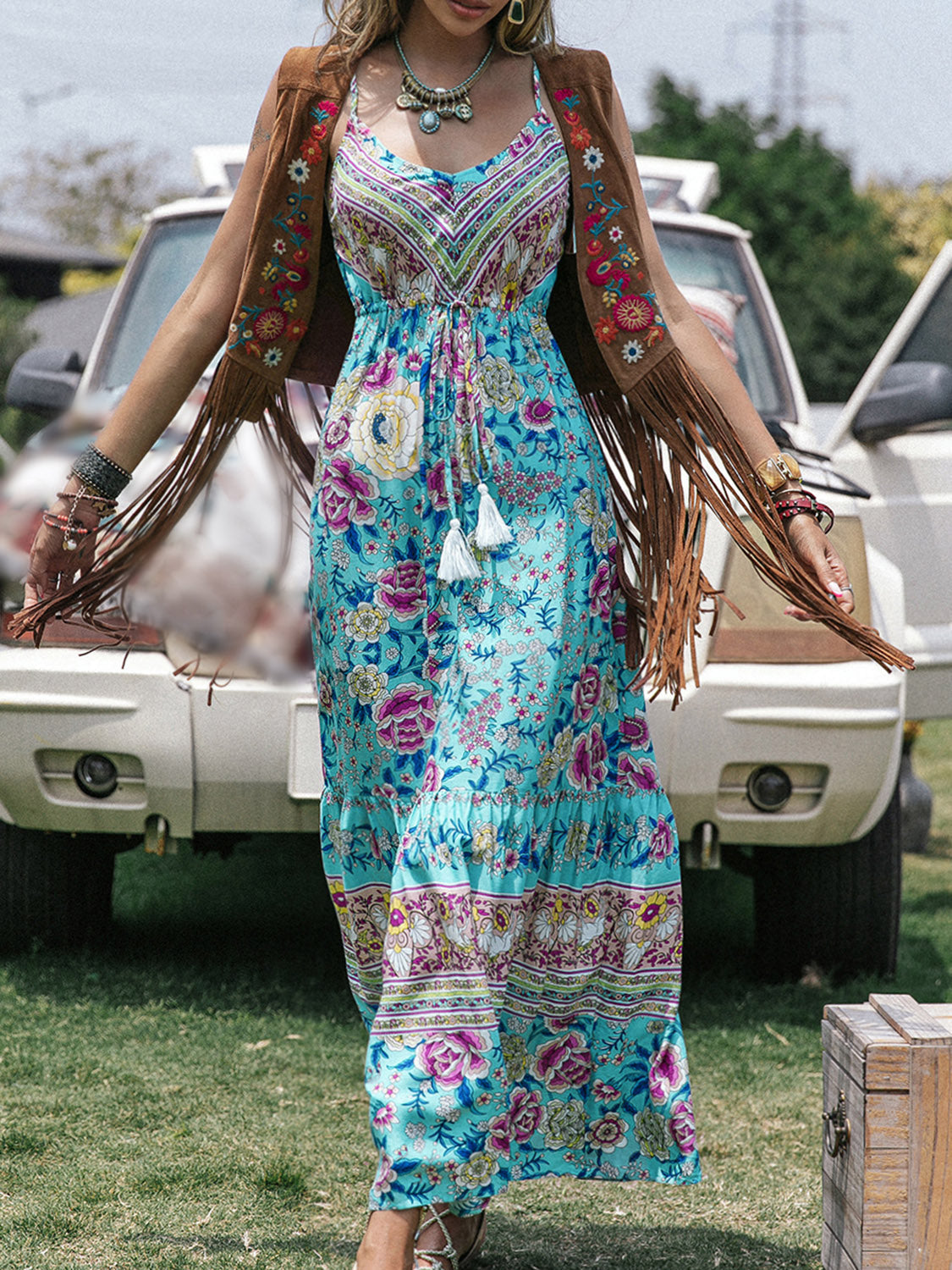 Bohemian printed scoop neck sleeveless maxi dress with floral pattern, perfect for beach style.