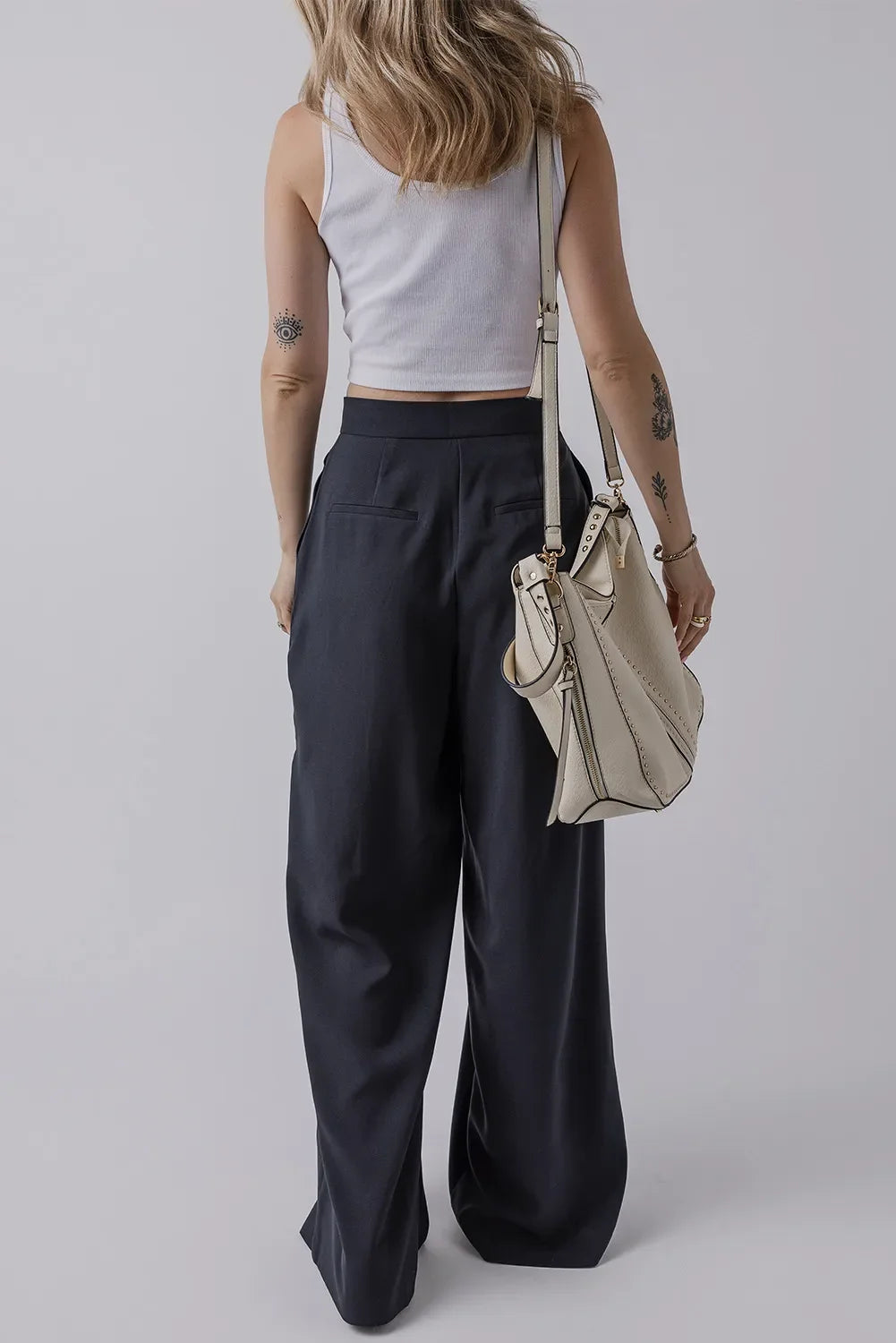 Wide leg black pants with pockets, 100% polyester, basic style.