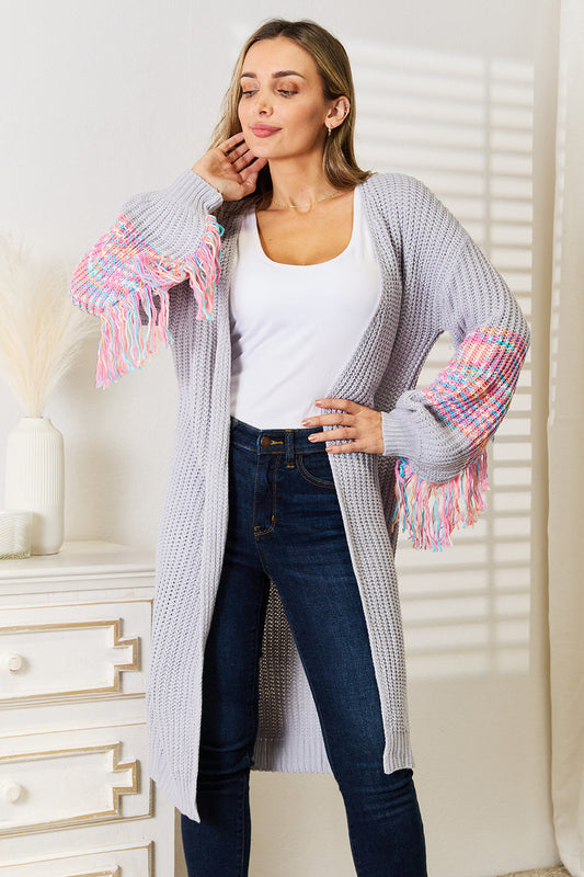 Boho style knitwear with woven fringe sleeve and dropped shoulder cardigan for women.