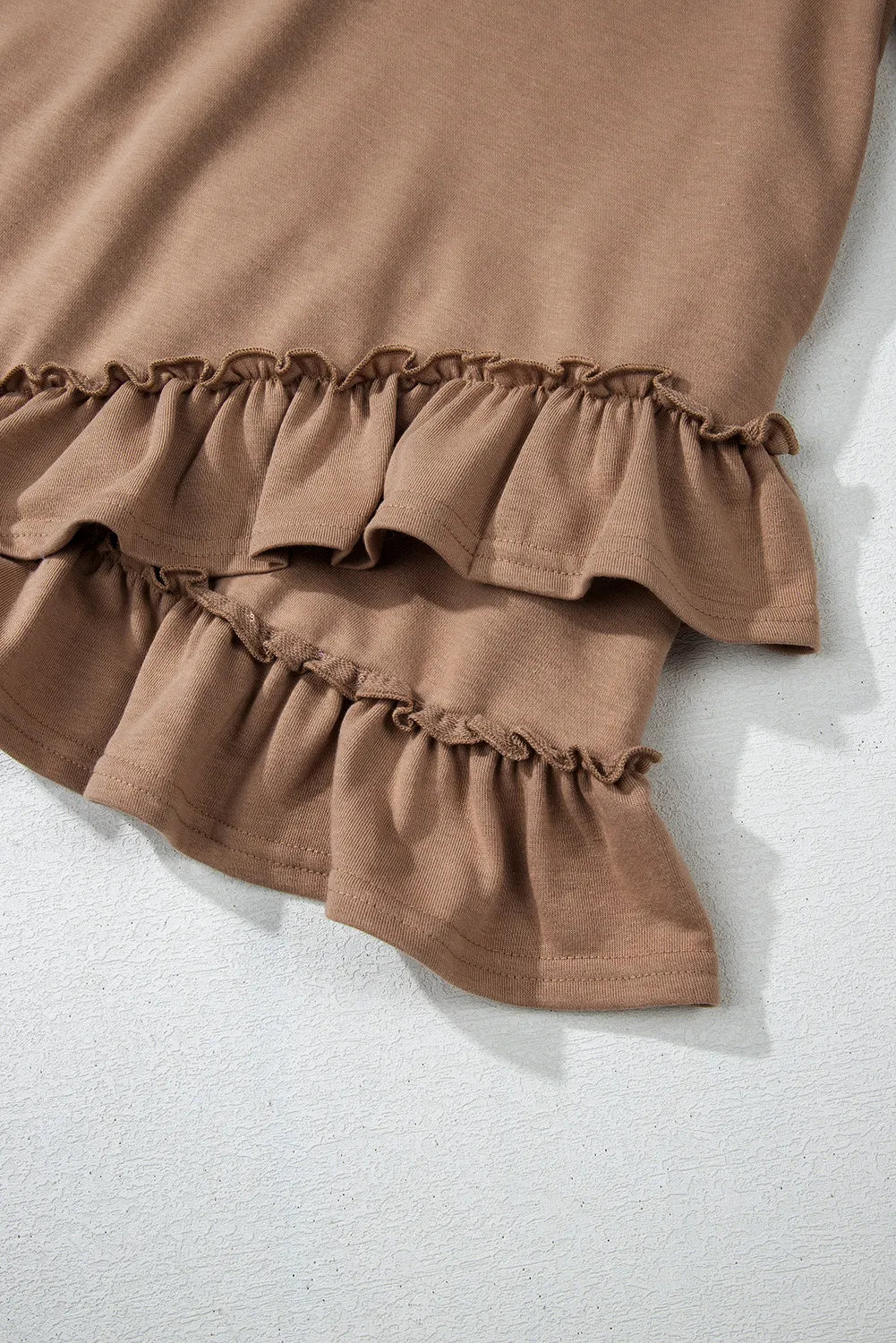 Ruffled scoop neck three-quarter sleeve mini dress in brown fabric.