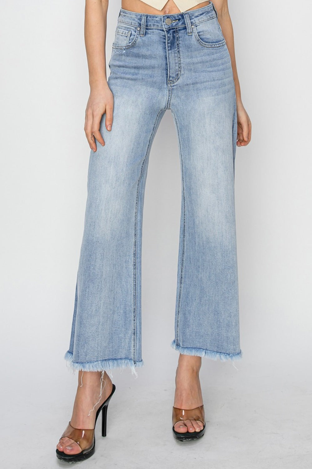 High rise crop wide fray hem jeans with a trendy and edgy style.