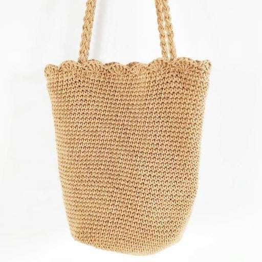 Knitted scalloped edge tote bag with braided strap and chic design.