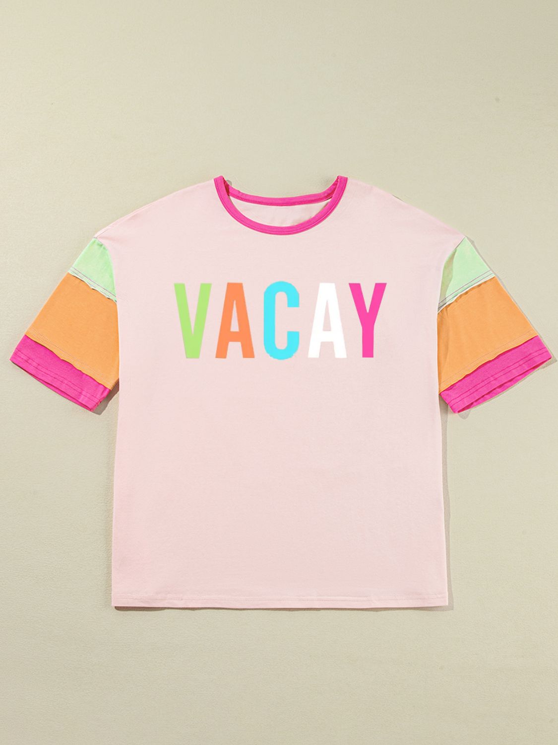 Vacay color block graphic t-shirt with pink, orange, and green sleeves, cotton blend, slightly stretchy.