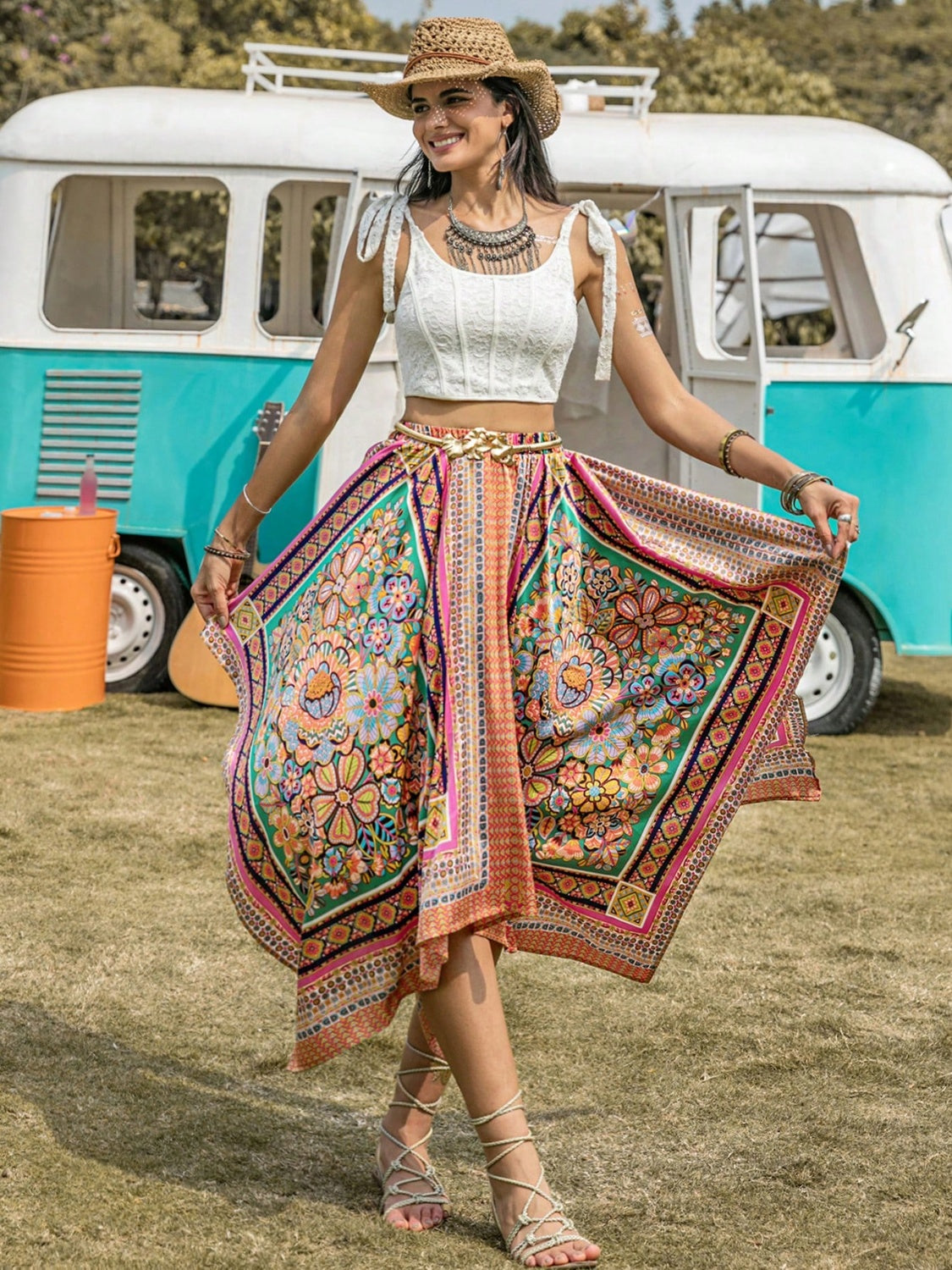 Woman wearing a colorful printed high waist handkerchief hem skirt outdoors.