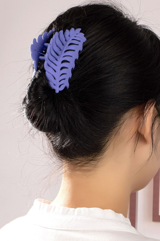 Feather Claw Hair Clip in matte color on woman's hair.