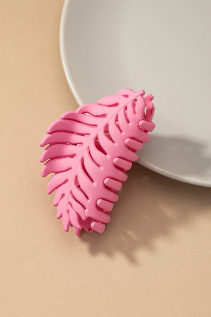 Feather-shaped pink matte hair clip made of high-quality acrylic.