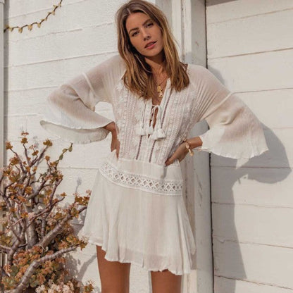 Romantic swimsuit cover up dress with tassel ties and drawstring neckline.