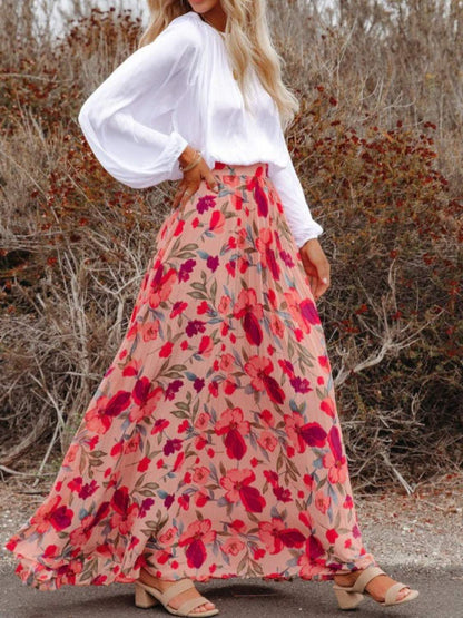 Floral print boho pleated maxi skirt with red and pink flowers.