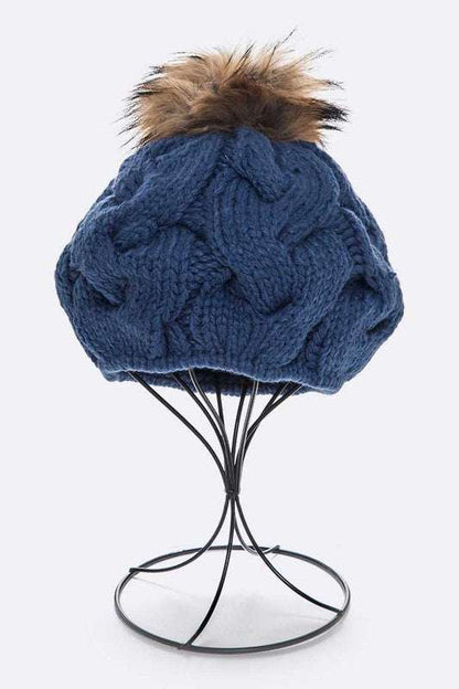 Large fur pom cable knit beret beanie with detachable faux fur pom.