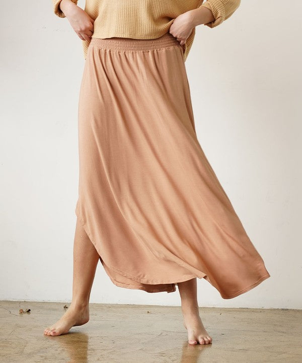 Bamboo Maxi Skirt with smocked elastic waist in peach color, made from organic bamboo and spandex, flexible fit.