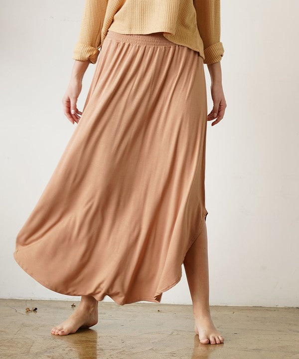 Organic bamboo maxi skirt with smocked elastic waist, flexible fit.