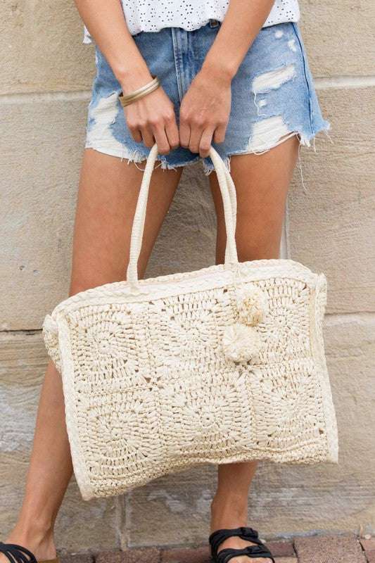 Eco Friendly Straw Traveler Tote with zipper closure and woven embellishment.