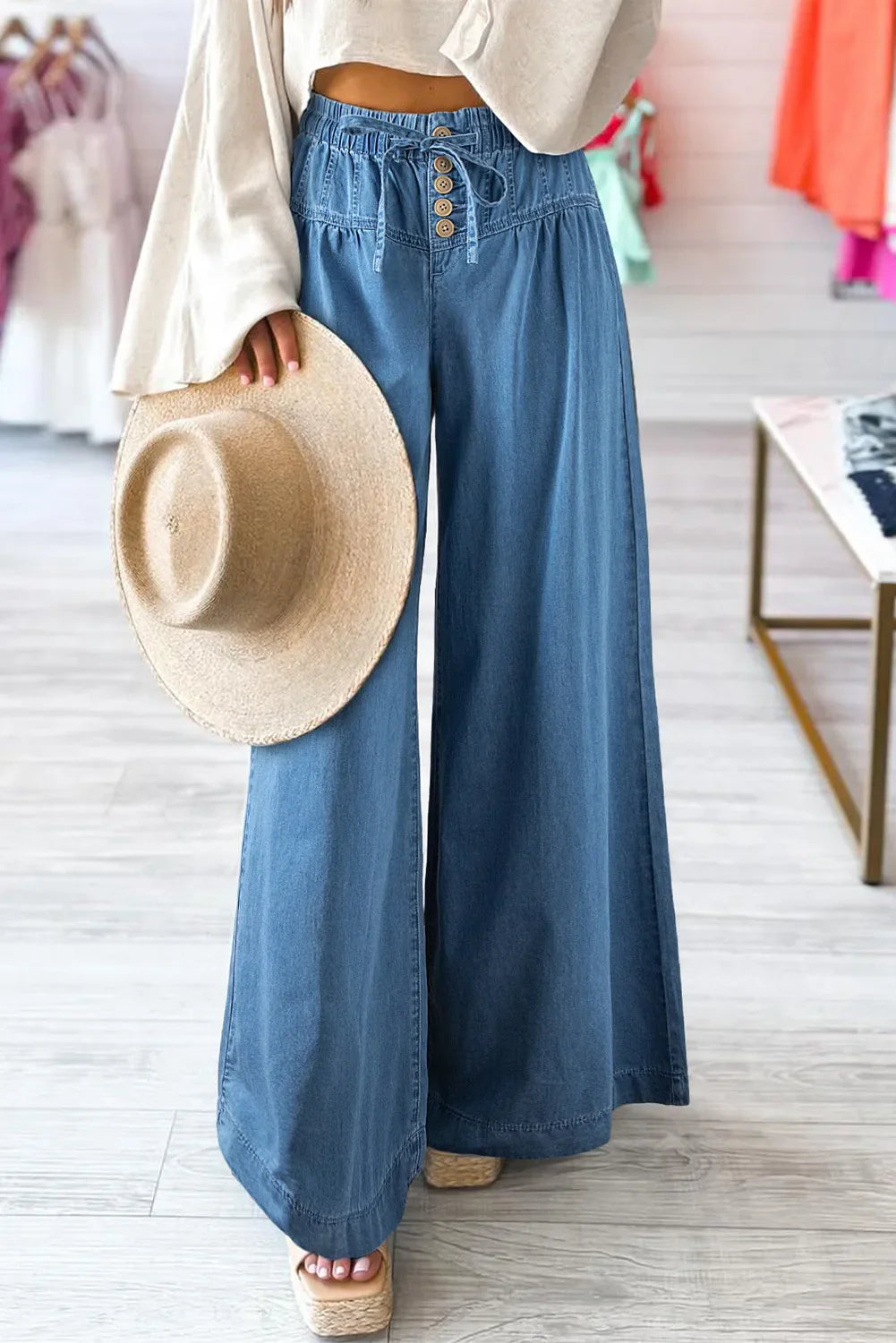 Drawstring elastic waist wide leg jeans in blue cotton, featuring a casual and comfortable fit.