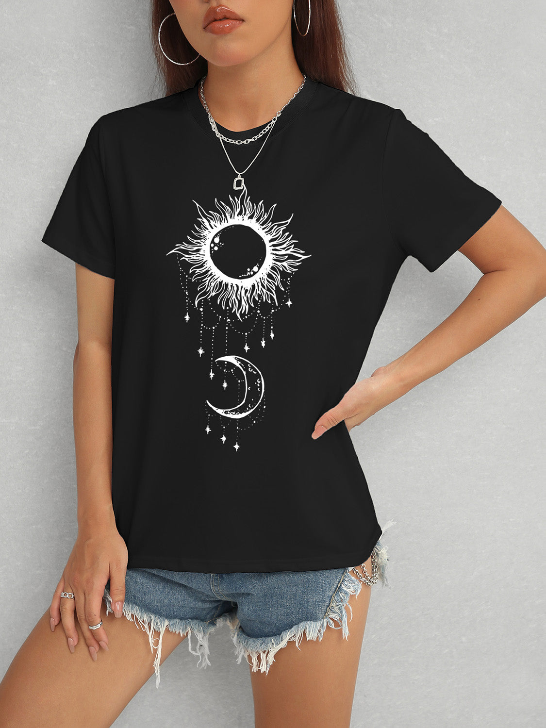 Black Sun & Moon Graphic T-Shirt with celestial design, slightly stretchy polyester blend.