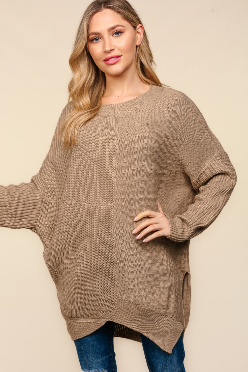 Side Slit Texture Asymmetrical Sweater with round neck and long sleeves in textured knit fabric.