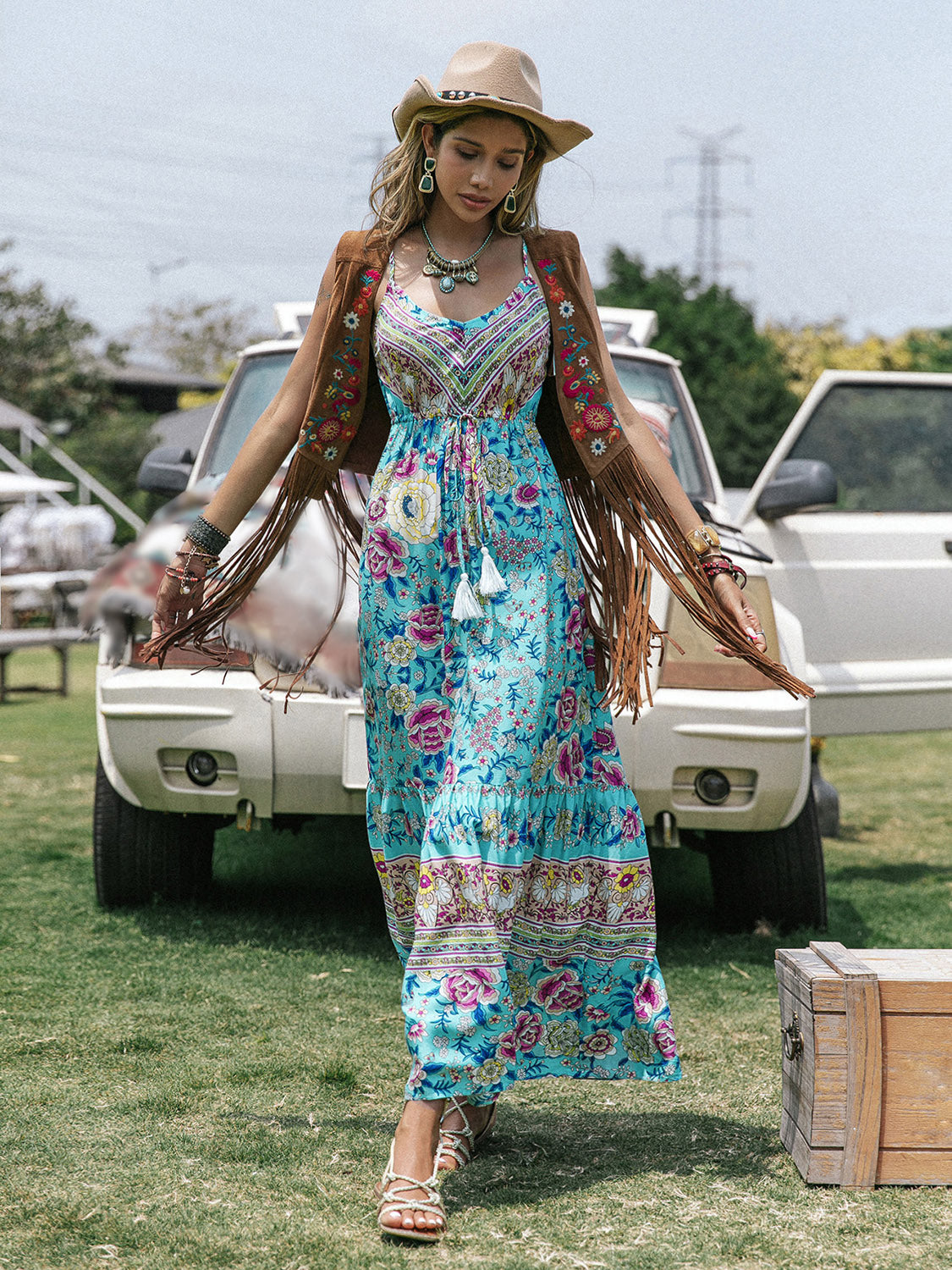 Bohemian printed scoop neck sleeveless maxi dress, beach style, worn by woman near vintage cars.