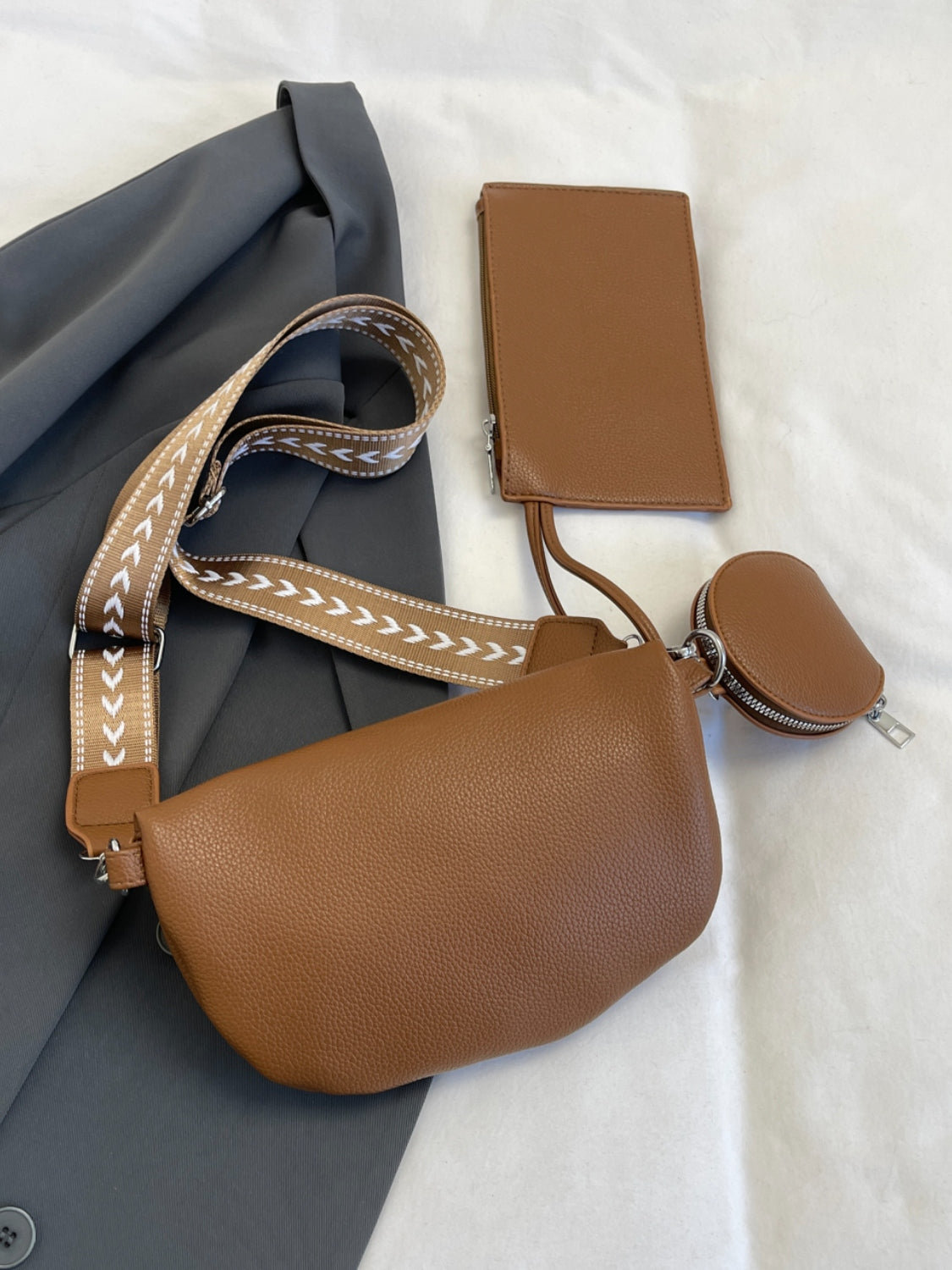 PU leather crossbody bag with adjustable strap and coin purse.