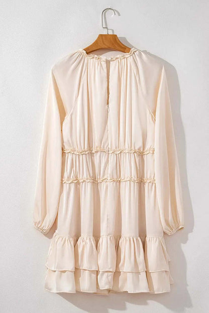 Frill ruffled V-neck long sleeve mini dress in cream color.