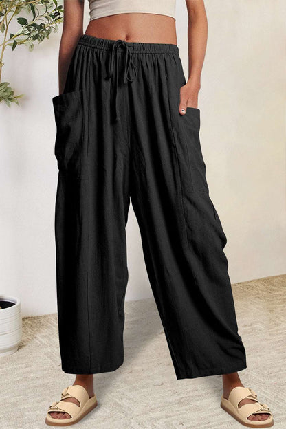 Boho wide leg harem pants with pockets, polyester fabric, black color.