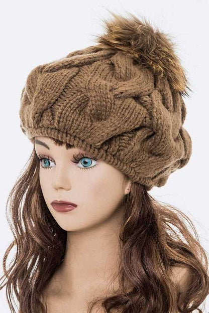 Large fur pom cable knit beret beanie with detachable pom.