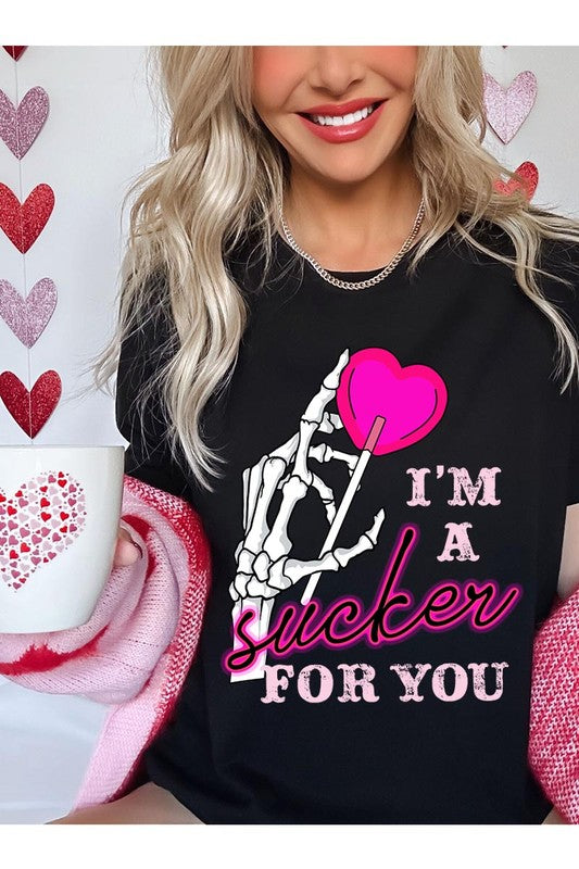 Skeleton heart and lollipop graphic tee with "I'm a Sucker for You" text.