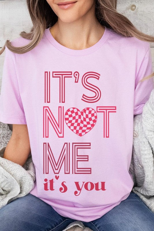 Unisex Valentine's Day T-Shirt with "It's Not Me It's You" graphic, casual style, short sleeves, round neck, pink.