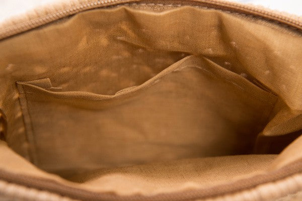 Interior view of Boho Macrame Crossbody Bag with cotton linen lining and sidewall pocket.