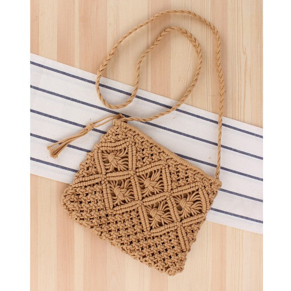 Boho macrame crossbody bag with tassel accent and woven design.