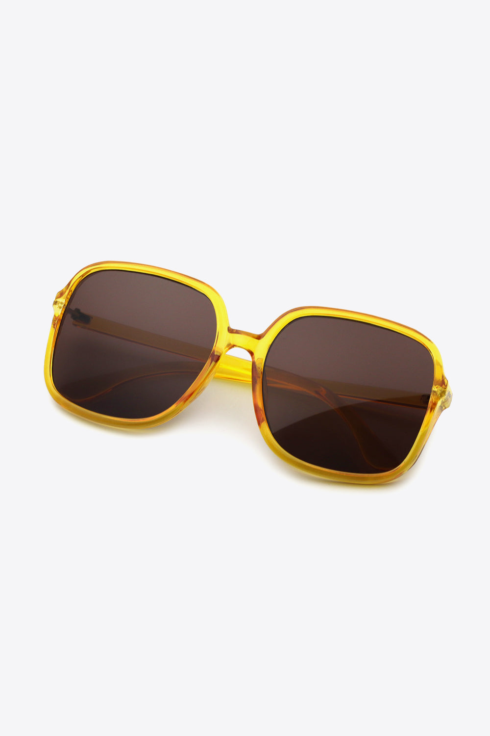 Oversized square sunglasses with UV400 protection and polycarbonate frame.