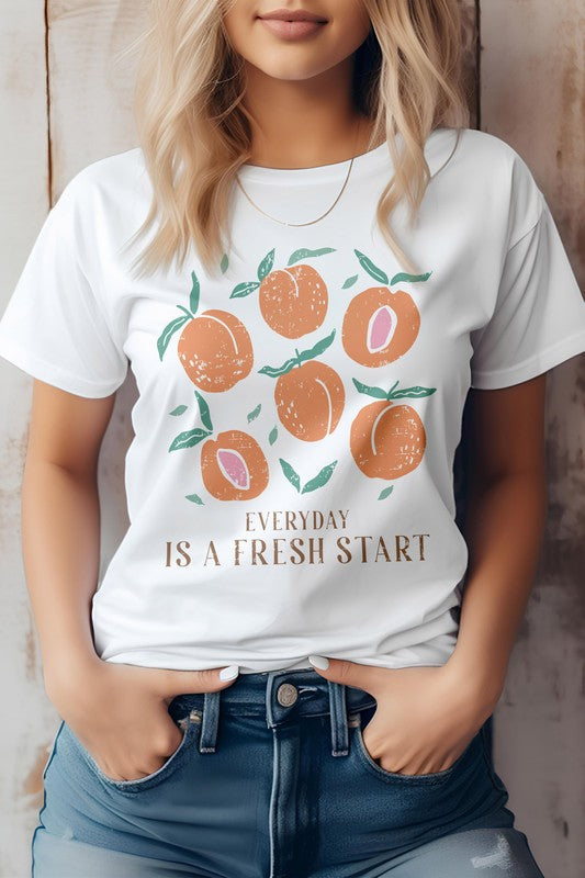 Boho graphic tee with "Everyday is a Fresh Start" print, made from eco-friendly cotton, featuring a unisex fit and crew neck.