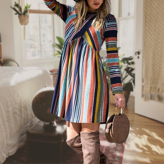 Multi Color Cross Stripe Midi Dress with long sleeves in a cozy room setting.