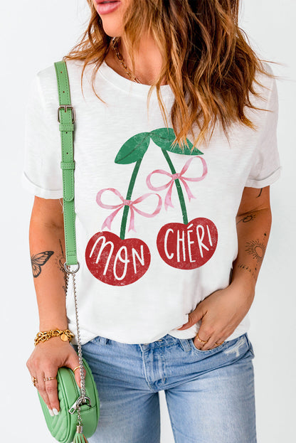 White Cherry Graphic T-Shirt with Mon Chéri print and green handbag.