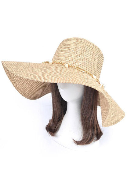 Pearl Mix Charm Floppy Sun Hat made of faux straw with shell and pearl accents.