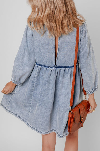 Adorable balloon sleeve denim dress with a back slit and slightly stretchy material.