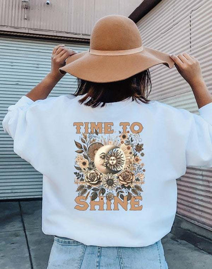 Time to Shine Graphic Sweatshirt with floral and celestial design.