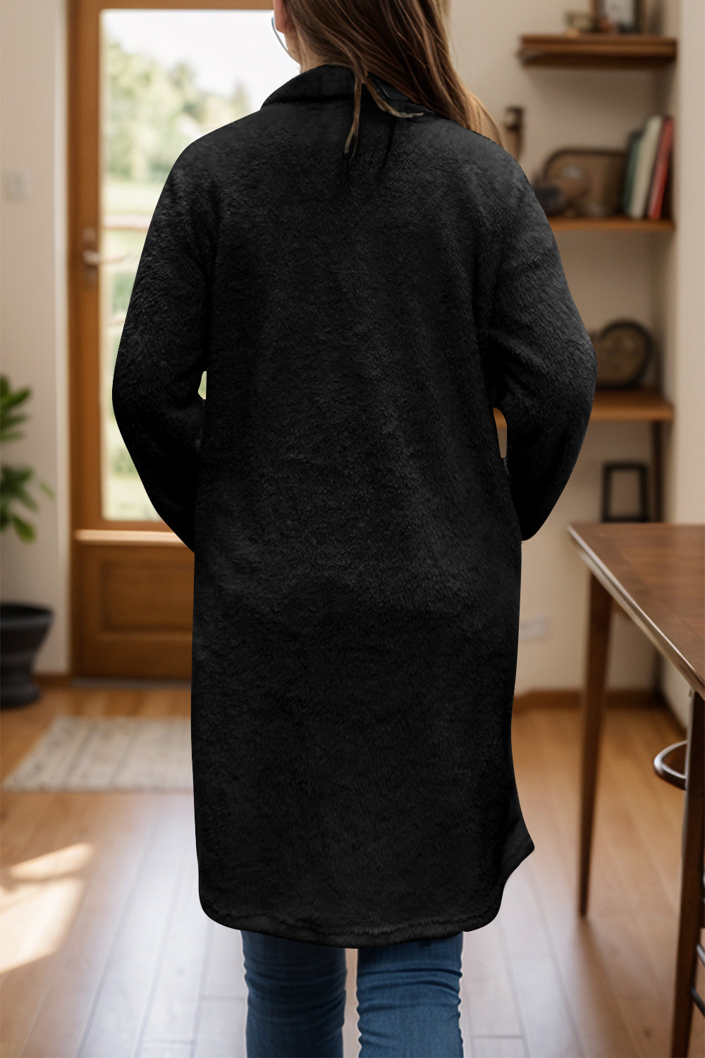 Button long sleeve longline plush coat in black, polyester material, back view.