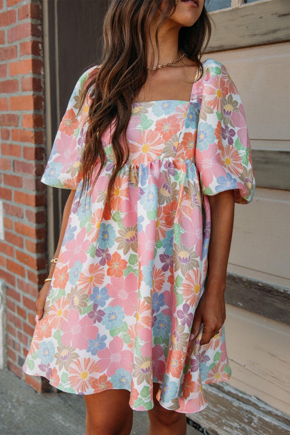 Pink floral dress with square neck and puff sleeves, perfect for summer.