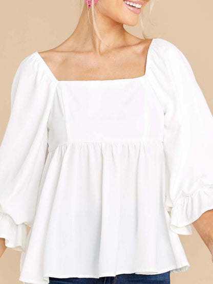 Smocked square neck flounce sleeve blouse in white, ruffled design, 100% polyester.