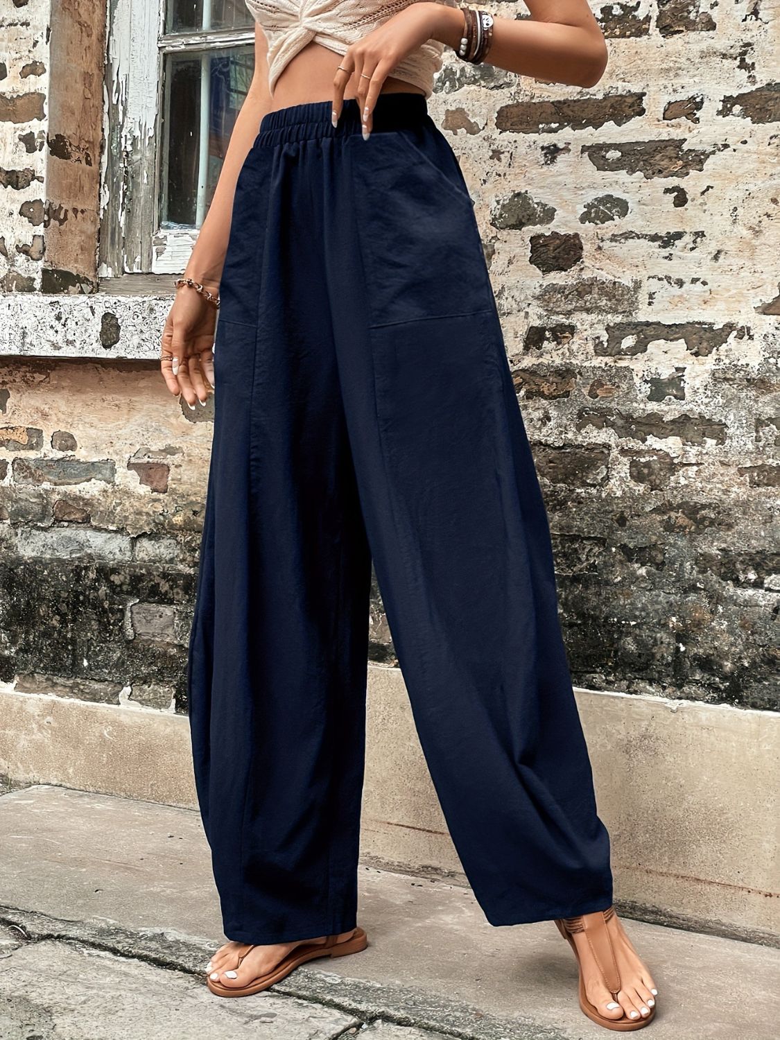 Elastic waist pants with pockets, navy blue, polyester blend, relaxed fit.