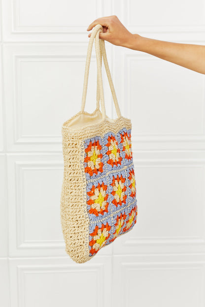 Large Off The Coast Straw Tote Bag with crochet design and embroidery pattern, featuring long straps for use as a handbag or shoulder bag.