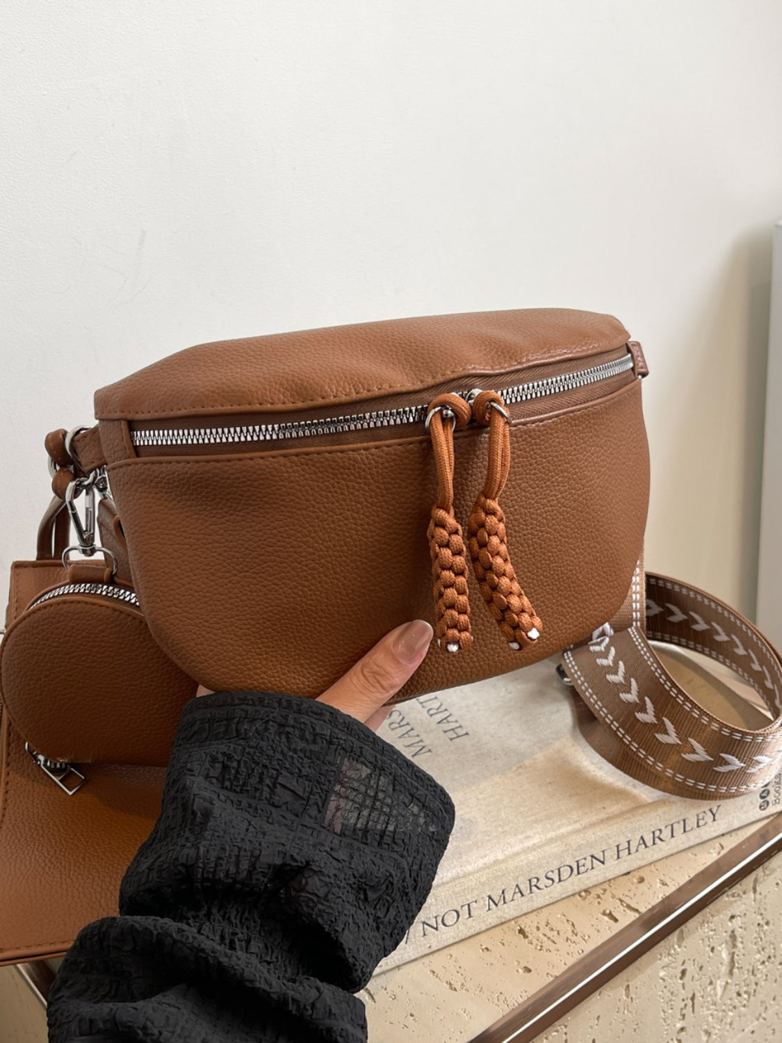 Medium PU leather crossbody bag with adjustable strap and coin purse.